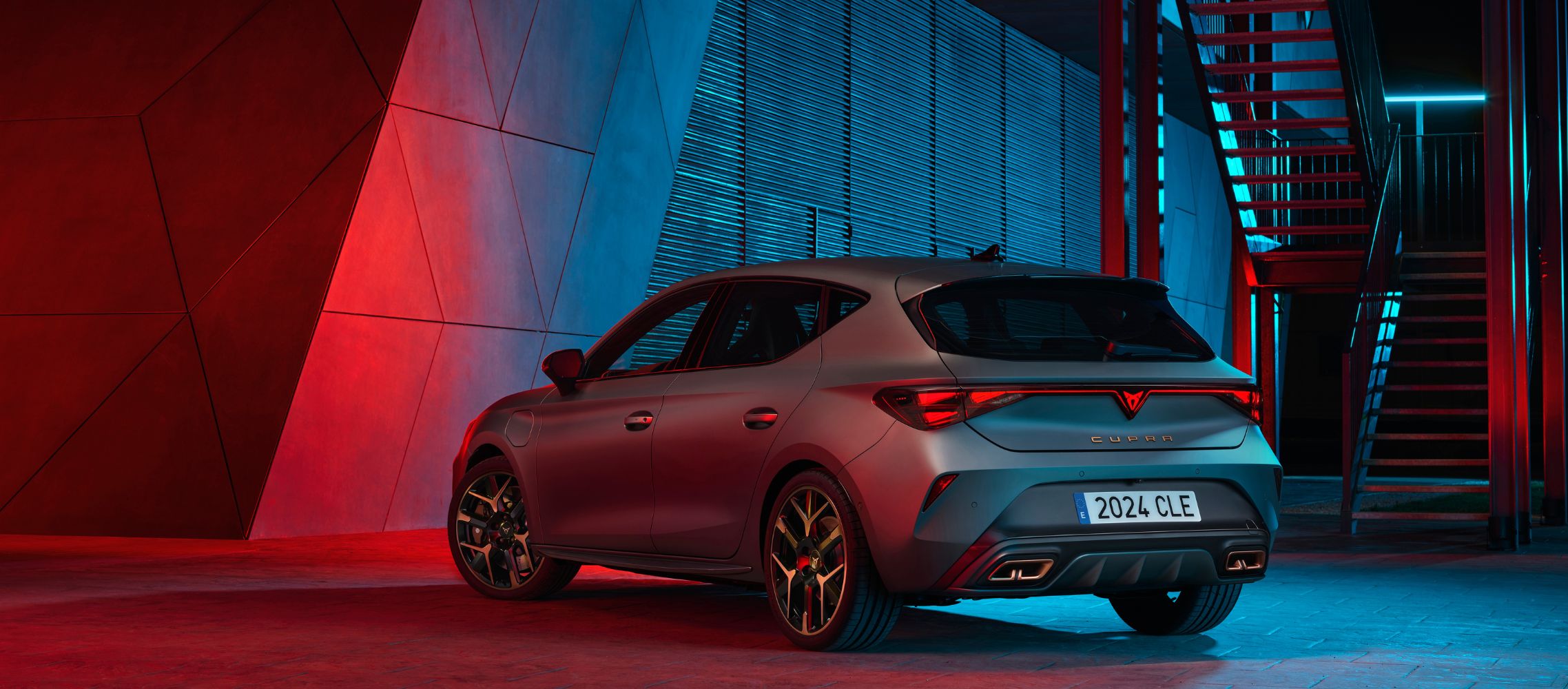 side view of a new 2024 cupra leon's red rear light, highlighting the sleek lines and lighting design against a dark background.​